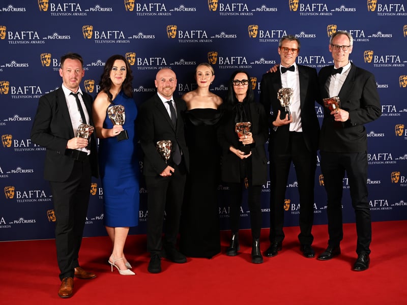 Tom Swingler, Carys Lewis, Max Shapira, Fiona Fletcher, Ed Kellie and Alf Lawrie pose inside the Winners Room with the Reality Award for 'The Jury: Murder Trial' at the 2025 BAFTA Television Awards.