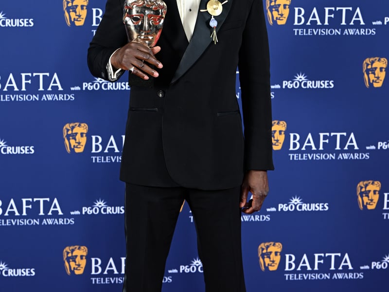 Ariyon Bakare poses with the Supporting Actor Award for 'Mr Loverman' inside the Winners Room at the 2025 BAFTA Television Awards.