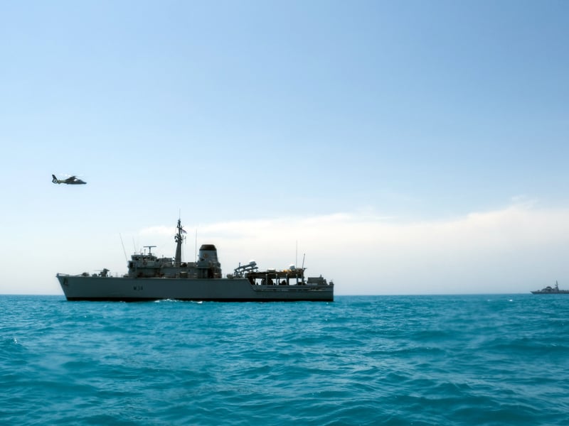Portsmouth-based Royal Navy minehunter HMS Middleton joined forces with American, Kuwaiti and Iraqi forces to conduct a rescue exercise in the Gulf. Picture: A Kuwaiti police helicopter flies past HMS Middleton