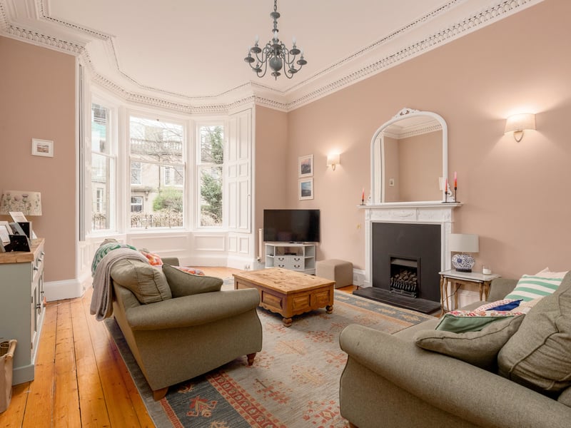 The grand south-facing sitting room is blessed with plenty light, loads of character and many original features.