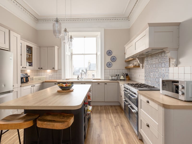 Gather round in the big kitchen at 22 Lennox Street, where a big island and breakfast bar make it a space perfect for sharing.