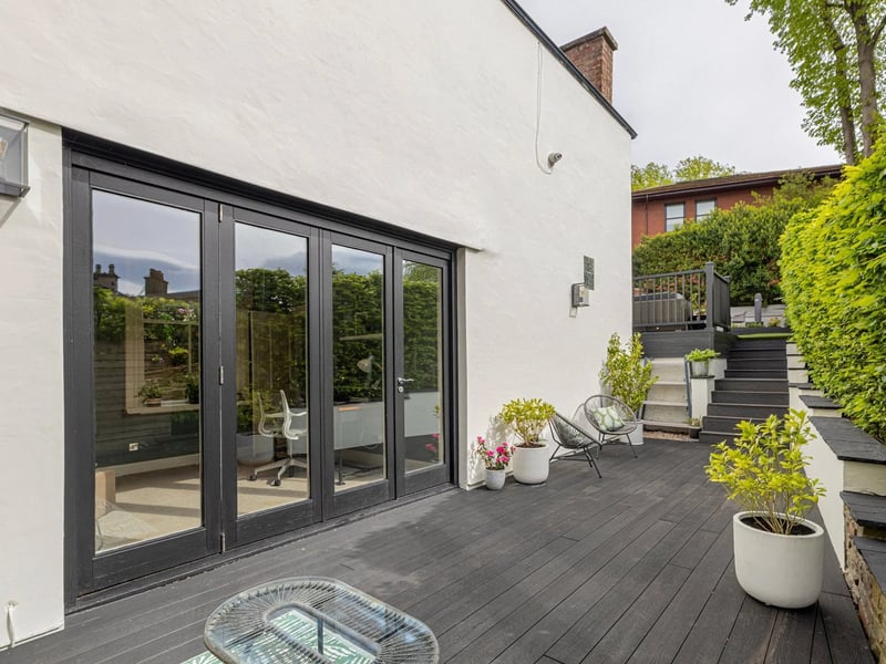 The kitchen diner doors lead out to a decked area of the garden.