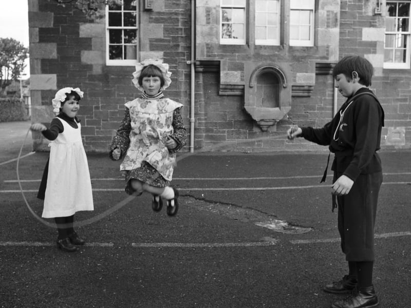 Children try some skipping in Victorian clothes at Whitekirk primary school in East Lothian as they celebrate its centenary by staging a playground scene from the 19th century.