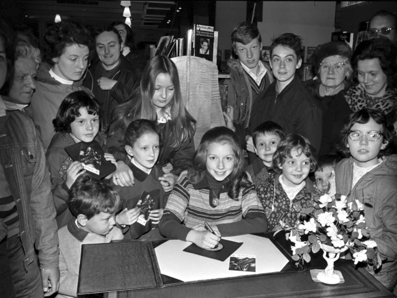12-year-old Scottish singer Lena Zavaroni signs records and autographs for fans at John Menzies bookshop in Edinburgh in April 1976.