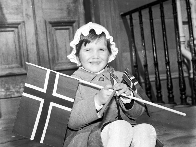 A little girl dressed up with flags for the Norwegian Constitution Day (Norway National Day) parade in Edinburgh in May 1977