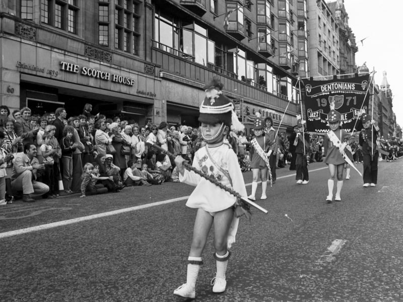 A young majorette leads the Dentonian school marching band in the Edinburgh Festival Cavalcade in Princes Street, August 1978.