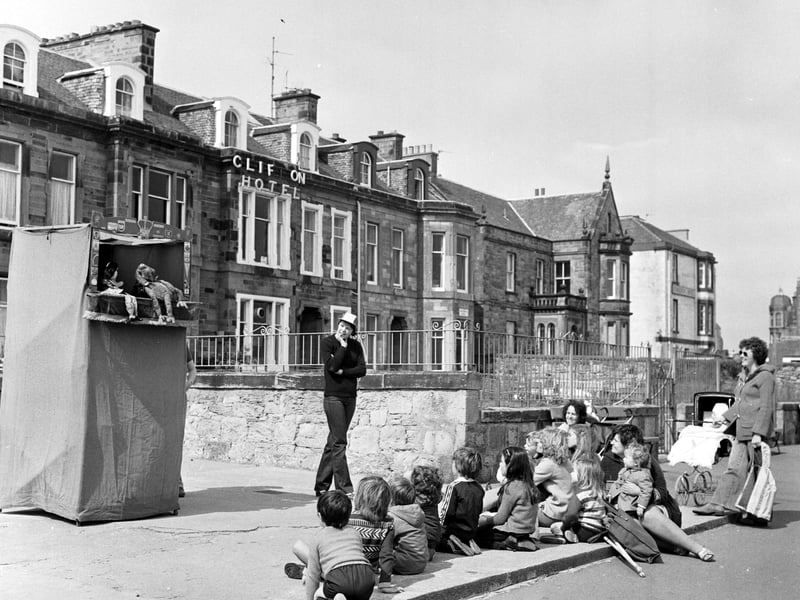 Children on Portobello promenade enjoy a puppet show in July 1979.