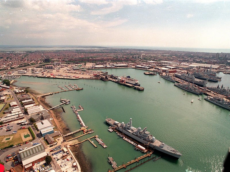 Air view of HMS Bristol and the sail training area at HMS Excellent / Whale Island, with the Dockyard / Naval Base in the background.