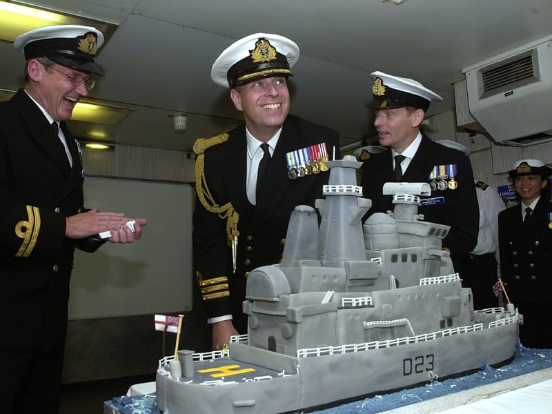 The Duke of York cuts the cake on board HMS Bristol celebrating the ships 30th birthday on July 25, 2003.