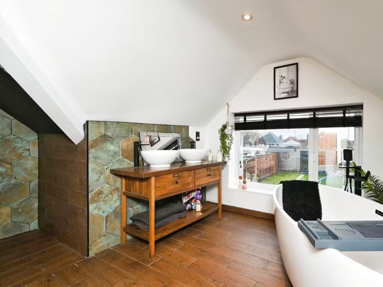 The stunning bathroom at this three-bedroom family home on Peafield Lane, Mansfield Woodhouse