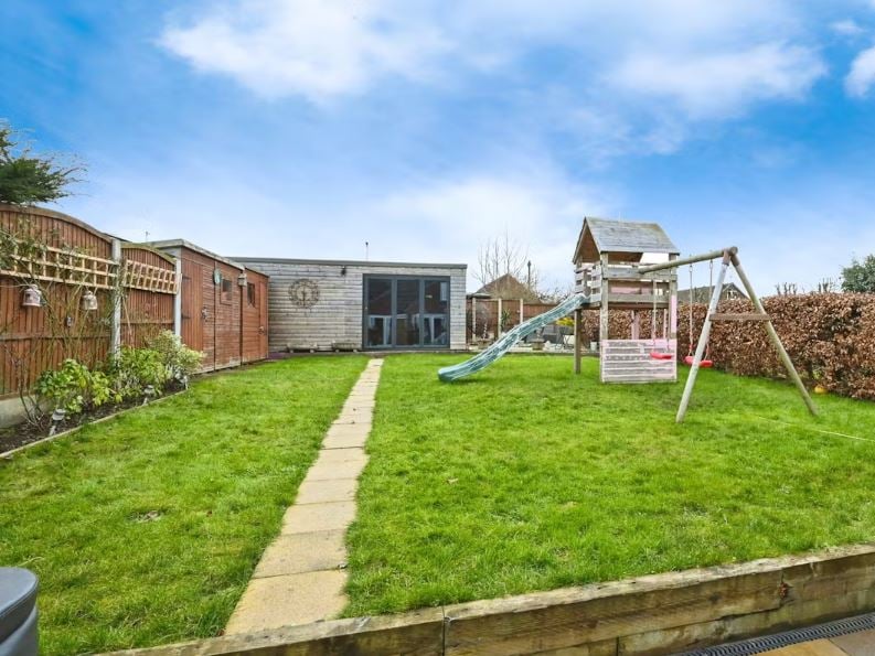 There's a good-sized garden for children to enjoy at the three-bedroom family home on Peafield Lane, Mansfield Woodhouse