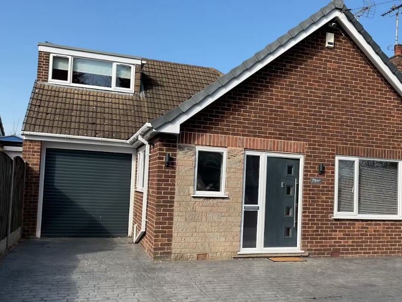 The three-bedroom family home on Peafield Lane, in Mansfield Woodhouse, has a driveway and tandem double garage
