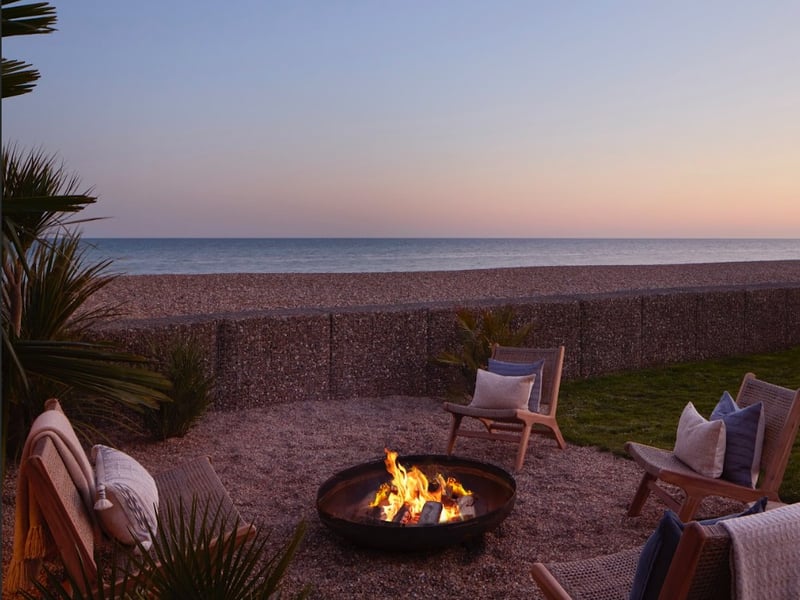 Watch the sun setting over the sea while seated around the fire pit at this £4m beachside villa, which is up for grabs in the latest Omaze prize draw