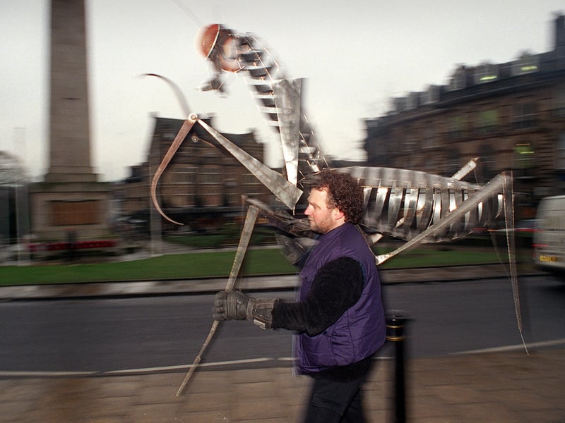 Sculptor Steve Blaylock displays his insect sculptures in the town centre without the council's permission. Pictured in December 1999.
