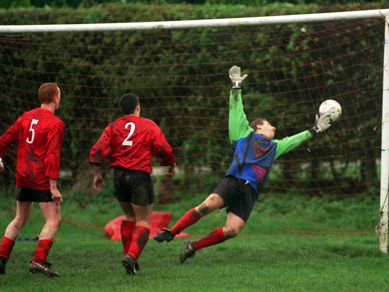 Harrogate Claro League match action from November 1999. Scholes defender Steve Robinson, no 2, heads past his own goalkeeper Steve Pace to score an own goal against Atlanta.