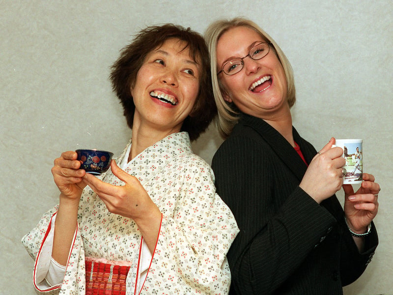 Japanese Tea Master Mutsumi Yamagiwa, left, shows the Japanese way of drinking tea, whilst  Karen Hefford   International Sales Co-Ordinator for Taylors Tea in Harrogate  shows the English way in November 1999.