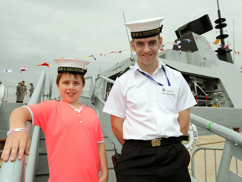 Navy Days 2010 at the Portsmouth Naval Base. Pictured is Daniel Toom 10 of Gosport with LSC Graham Brown in-front of HMS Dauntless