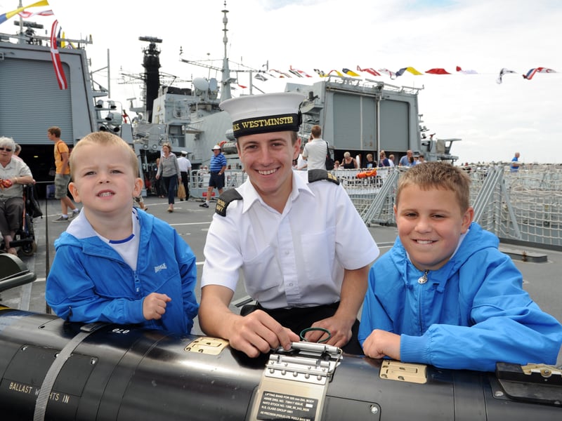 Navy Days 2010 at the Portsmouth Naval Base. Pictured onboard HMS Westminster leaning on a torpedo are brothers Harlee Cooper 3 and Joe Cooper 10 with ET Luke Wills