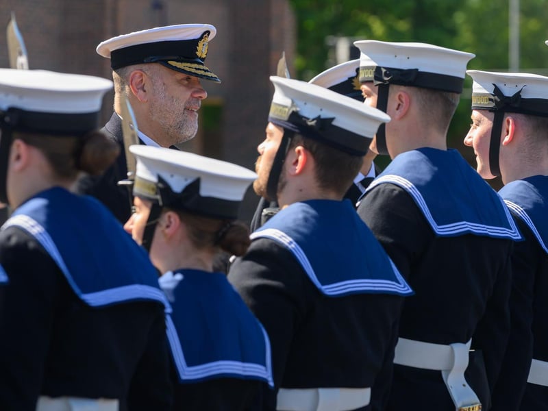 The Royal Navy Rear Admiral inspecting the guard at HMS Collingwood.