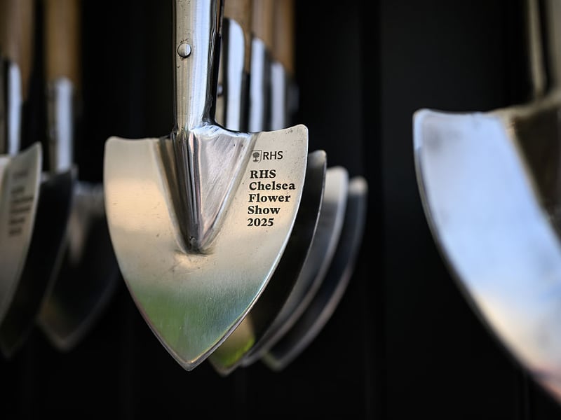 Branded gardening tools are displayed on the Burgon and Ball stand at the Chelsea Flower Show.