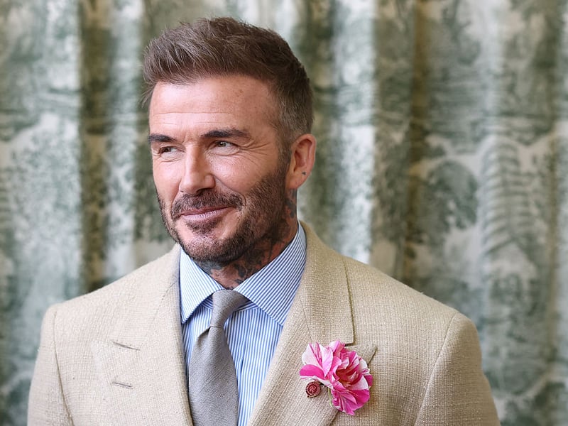 Footballer David Beckham waits to welcome King Charles III to the Chelsea Flower Show.