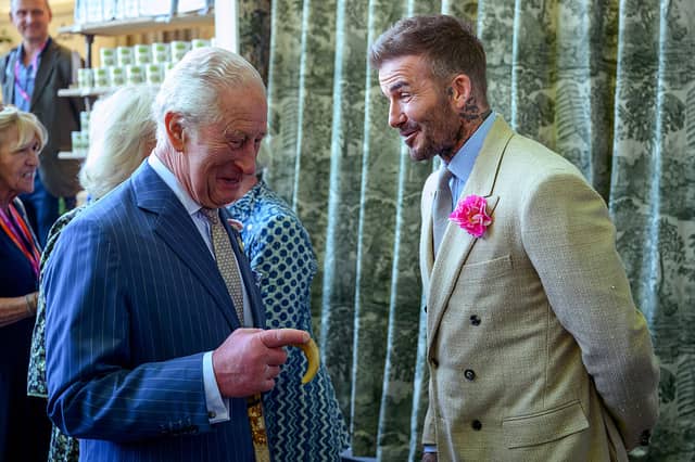 King Charles III chats to footballer David Beckham at the Chelsea Flower Show.