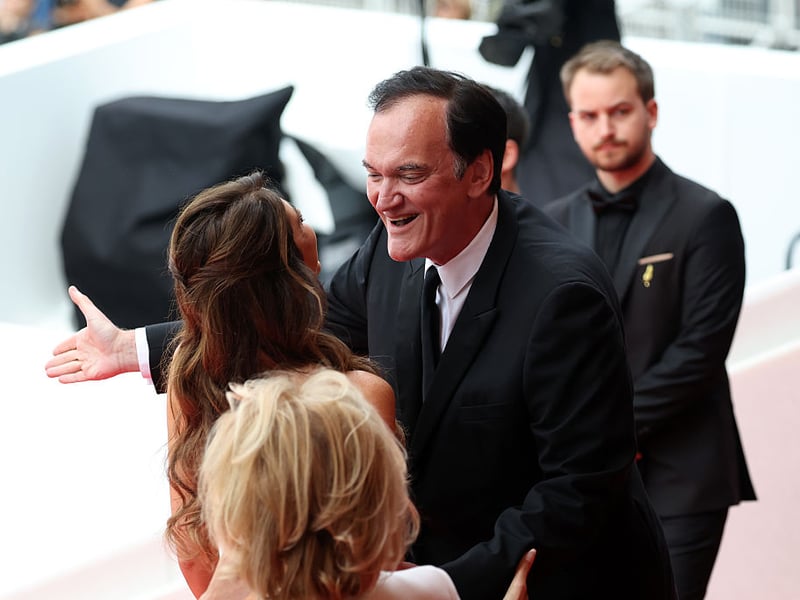 Daniella Tarantino and Quentin Tarantino attend the 'Nouvelle Vague' red carpet.