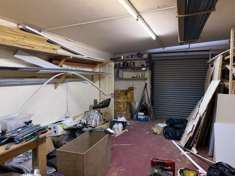 The listing says: "The shop would benefit from being remodelled to provide a smaller retail space, with the existing large store to the rear being converted to residential use, subject to all necessary consents being obtainable." 
