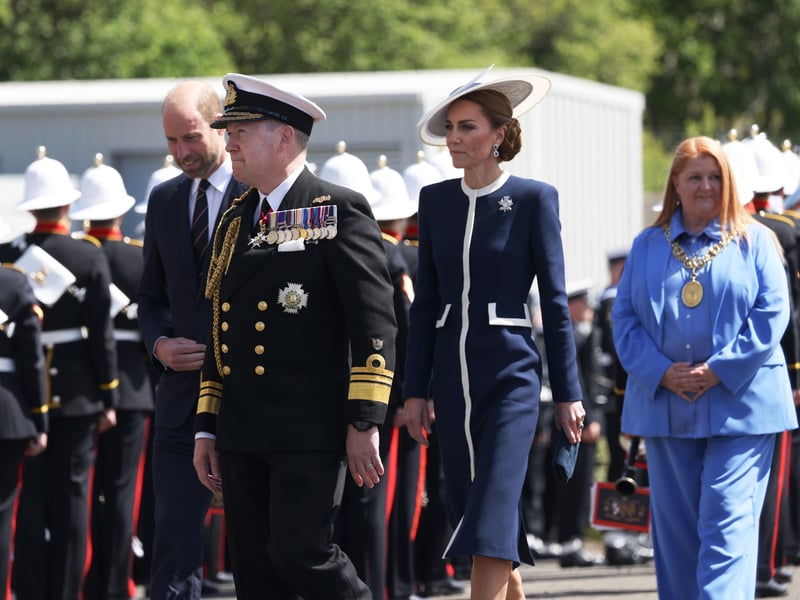 Her Royal Highness The Princess of Wales and her husband  HRH The Prince of Wales are led by the Second Sea Lord Vice Admiral Sir Martin Connell