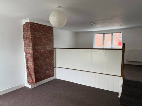 The auction listing says: "The current residential accommodation comprises a flat on the first floor with access from the side."