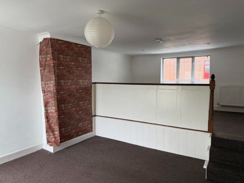 The auction listing says: "The current residential accommodation comprises a flat on the first floor with access from the side." 