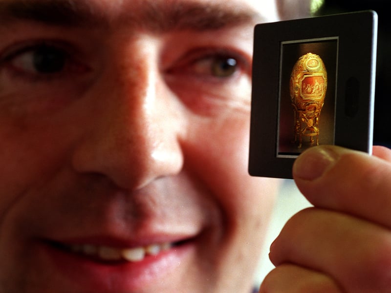 Antiques Road Show expert, John Benjamin, with a slide of a Faberge Egg in Harrogate. Pictured in April 1999.