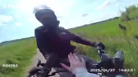Shocking footage shows the moment an off-road biker in Doncaster tried to ram a police officer with a suspected stolen motorbike.