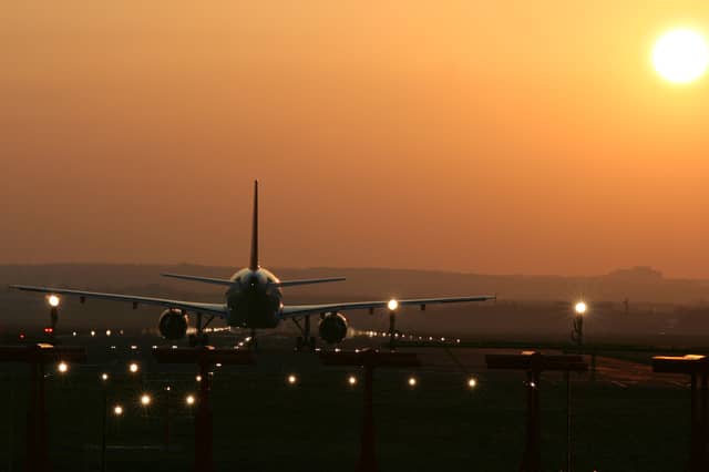 Aircraft taking off into the sunset at Edinburgh Airport