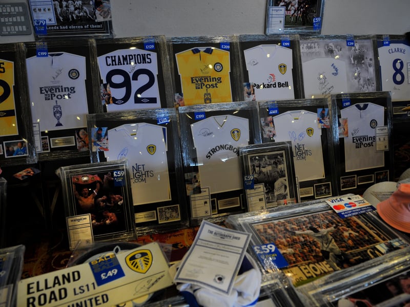 A selection of historic framed Leeds United shirts for sale.