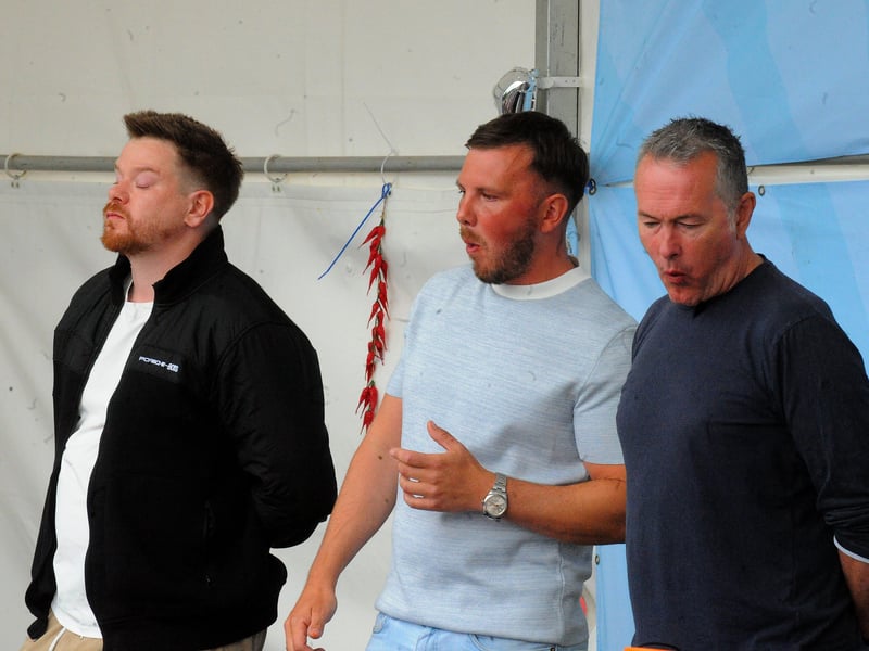 Contestants in the chilli eating contest start to feel the heat.