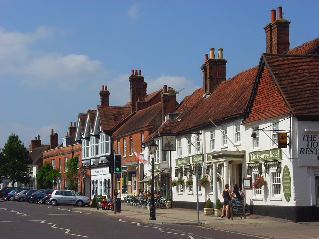 Odiham is pronounced "Oh-dee-um" or "O-dee-ham"	by can be mispronounced as "Oddy-ham". The first written record of Odiham's existence is in the Domesday Book (1086), where it appears with its current spelling, although the spellings Odiam and Wudiham have sometimes been used since. King John decided in 1204 to build Odiham Castle and it was built during the years 1207 to 1214 at a cost of over £1,000. It has been at the centre of much royal history ever since, including being a location where Kings Henry VIII stayed with Anne Boleyn.