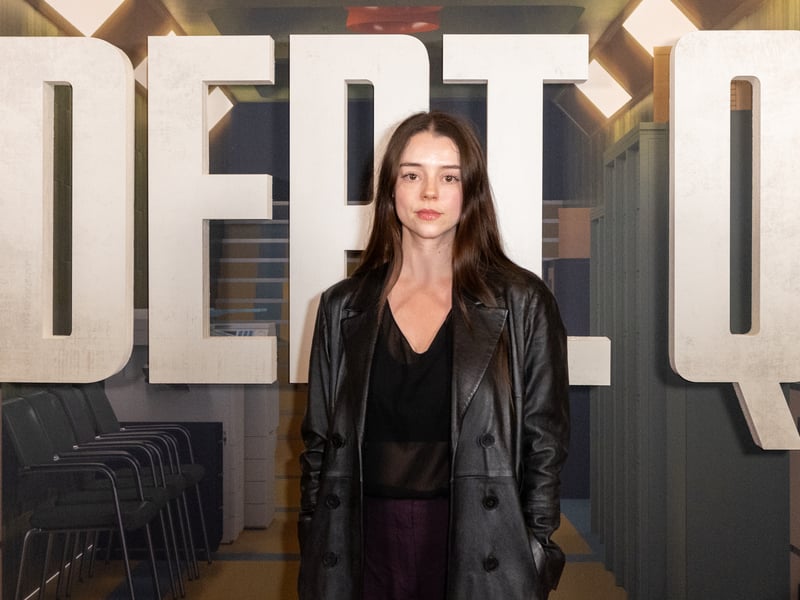 Having played a lead role in Karen Pirie, Scottish actress Bobby Rainsbury is set to appear in Channel 4 drama Summerwater as well as The Death of Bunny Munro, Outlander: Blood of My Blood and Last Breath. In Dept. Q, she plays a younger version of Chloe Pirrie’s character Merritt Lingard.