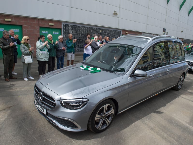 The hearse carrying Sir Tom Farmer passes by Easter Road.
