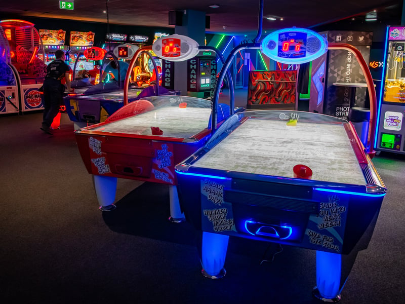 Enjoy all-time great arcade games like air hockey.