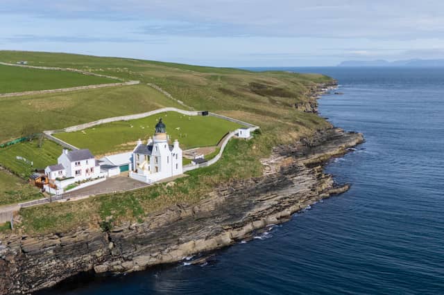 Holborn Head lighthouse stands in an outstanding setting with elevated views over Scrabster beach in Caithness over to Dunnet Head, Orkney and the Old Man of Hoy.