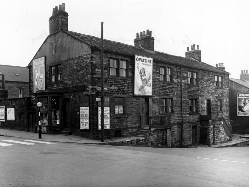 A view looking south-west at the junction of Swinnow Road and Stanningley Road (number 491, on the corner, is J. Turner, boot and shoe repairs). Advertising posters for Fairy Soap, Ovaltine, SunKap Drinks and various cinema programme posters, (including Palace Pictures and Pavilion) are visible.