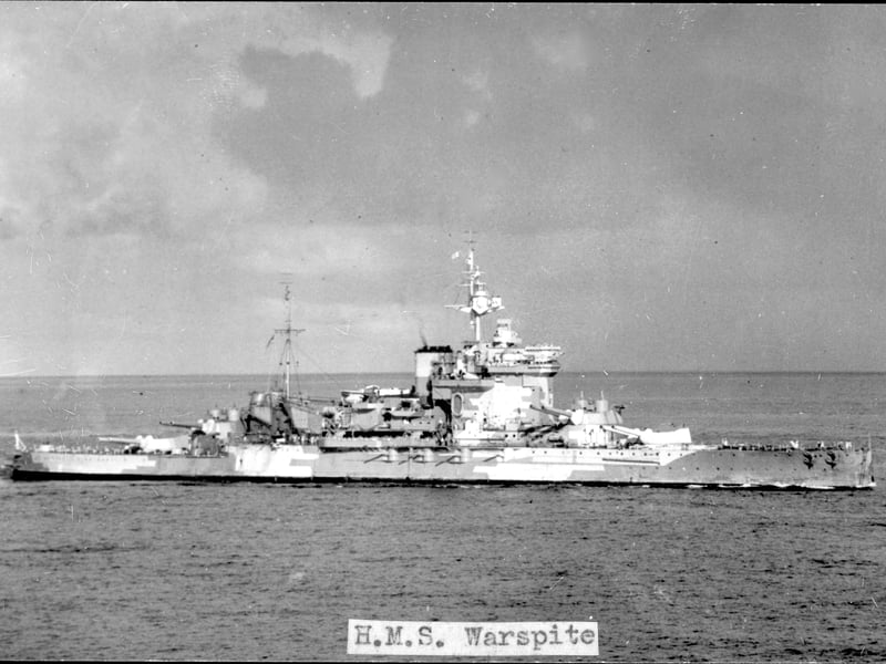 Commissioned during WWI, HMS Warspite was a Queen Elizabeth-class battleship famed for her resilience and firepower. She fought at Jutland in 1916 and played a key role in WWII, from Narvik and the Mediterranean to Normandy. Despite frequent damage, she kept returning to service, earning more battle honours than any other Royal Navy ship. Decommissioned in 1945, her planned preservation failed, and she was partially scrapped after breaking free during tow in 1947.