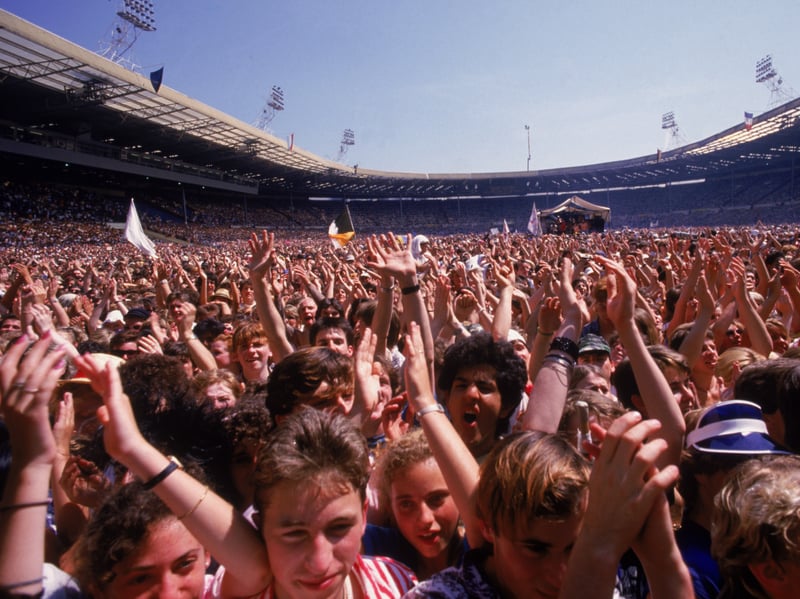 Live Aid was surely the feel-good moment of the 80s, as the world's best musicians came together to raise millions for charity and put on one of the greatest shows ever seen. The event was organised by Bob Geldof and Midge Ure in response to the famine in Ethiopia, with two huge fundraising concerts staged simultaneously at Wembley Stadium and across the Atlantic at the John F. Kennedy Stadium in Philadelphia. Concerts were also staged in other countries around the world, with an estimated 1.9 billion viewers around the globe tuning in for the live broadcast. The Wembley gig featured performances from the likes of Queen, David Bowie, The Who, Elton John and Paul McCartney, and ended with a rousing rendition of the Band Aid charity single Do They Know It's Christmas?.