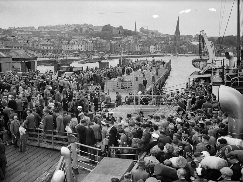 Crowds of holidaymakers coming ashore at Rothesay pier on July 17, 1956 for the Glasgow Fair holiday