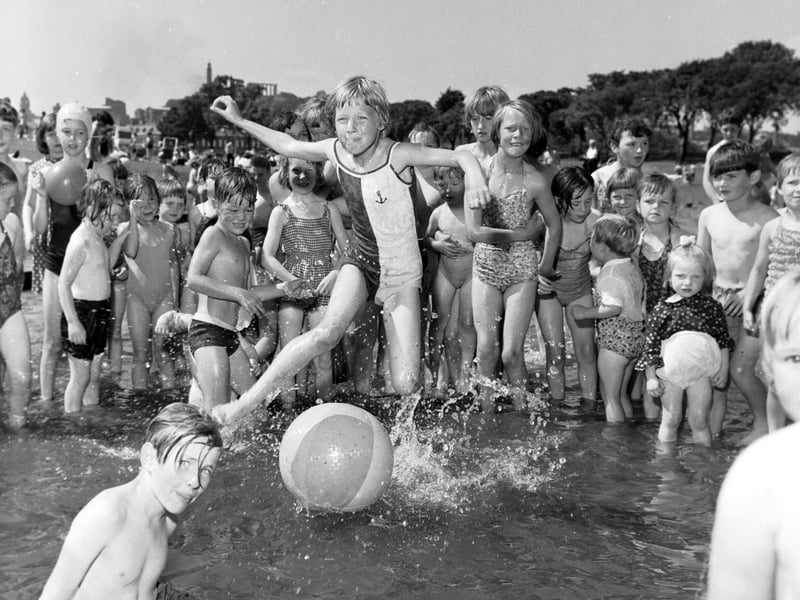 Children in the paddling pool at St Margaret's Loch, Holyrood Park, Edinburgh, as temperatures soared to 77F in July 1966