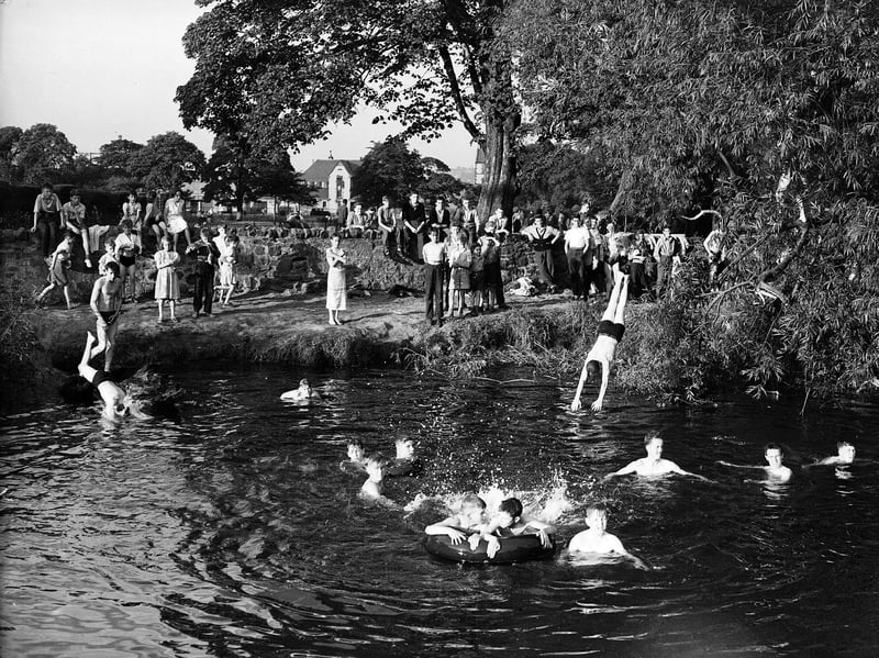 Youngsters bathe in Water of Leith at Saughton, Edinburgh, during the hot July of 1955