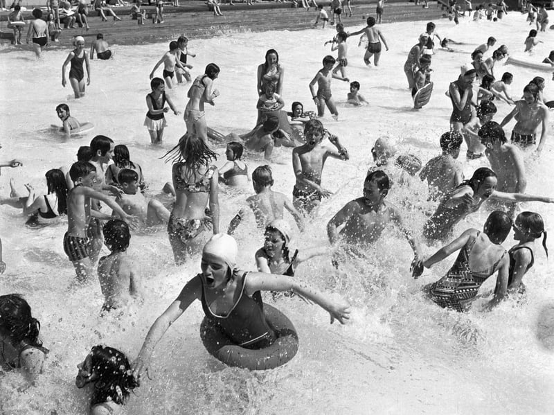 Families enjoying the summer sunshine at Portobello open-air swimming pool near Edinburgh in July 1971