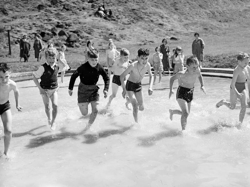 Boys in the paddling pool at St Margaret's Loch, Queens Park  (Holyrood Park), Edinburgh, during the summer holidays in 1959