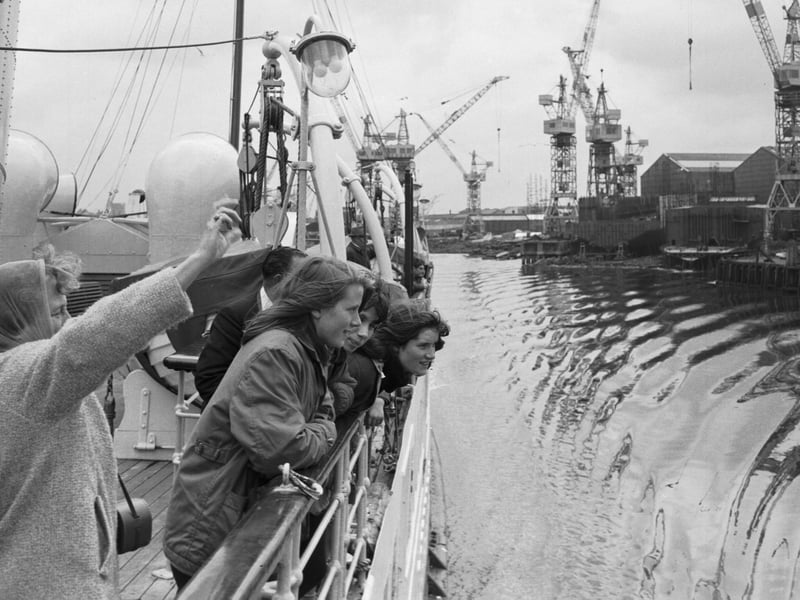 Glasgow holidaymakers on board the Queen Mary II steamer take a trip down the River Clyde in July 1966